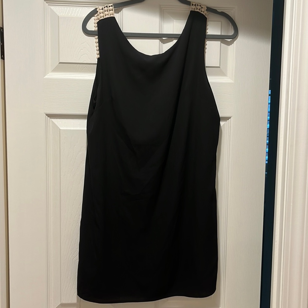 Backless black shift dress with white detail